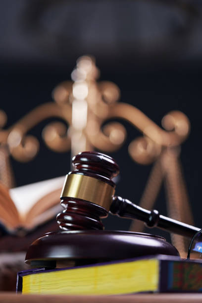 sharia law concept , gavel hammer libra scale and holly koran
